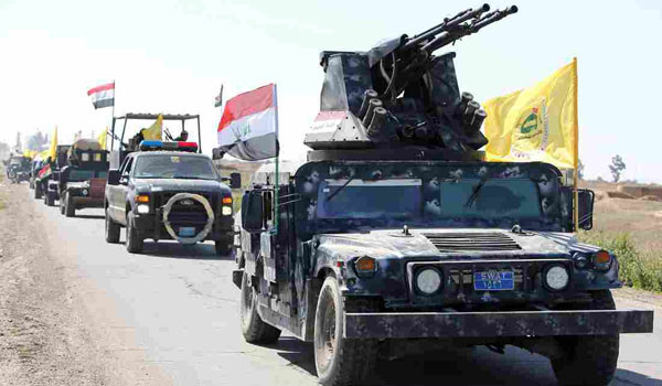 ▲ 테러조직 ISIS가 점령했던 티크리트로 진격하는 이라크 보안군과 시아파 민병대. 이들 가운데는 이란 특수부대도 끼어 있다. ⓒ美공영 NPR 보도화면 캡쳐