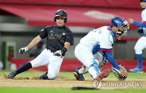 ▲ 광주 하계유니버시아 대회에 출전한 한국 야구 대표팀. 사진은 일본과의 경기 장면이다.ⓒ연합뉴스