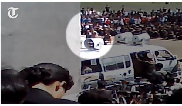 ▲ 英텔레그라프가 단독 공개한 북한 인민재판의 한 장면. 밝은 동그라미 안의 남성이 '죄인'이다. 이들은 미국 영화를 본 죄로 강제노동 9개월형에 처해졌다. ⓒ英텔레그라프 공개영상 캡쳐