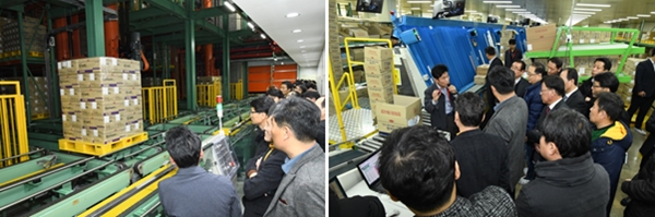 ▲ 국내 도매업체 관계자들이 한미약품의 팔탄 스마트플랜트 자동화 창고와 배송 준비 중인 의약품을 보고 있다. ⓒ한미약품