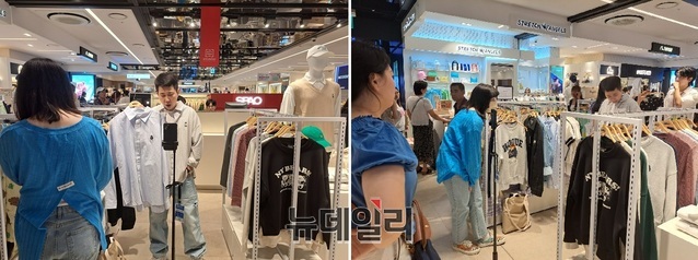 ▲ 왕홍이 매장에서 실시간 방송을 통해 의류 제품을 판매하고 있다.ⓒ조현우 기자