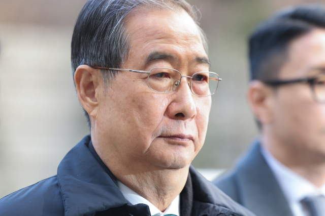 ▲ 내란 우두머리 방조 혐의를 받는 한덕수 전 국무총리가 지난 1월 21일 서울중앙지법에서 열린 1심 선고 공판에 출석하기 위해 법정으로 향하고 있다. ⓒ연합뉴스